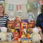 2 women sat with easter eggs and easter decorations 
