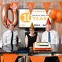5 people sat in front of logo celebrating 10 years with ballons and whistles 