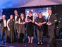 the 6 winners from NWBusAwards on stage with their trophies 