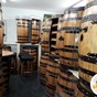 abywell finished whiskey barrels which have been turned into wine racks