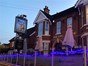 blue lights outside a pub 