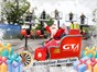 Santa sitting in a GTA branded sleigh with 5 people behind in cherry pickers wearing santa hats and high vis jackets 