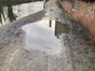 Image shows canal towpath in Kidderminster with flooded path
