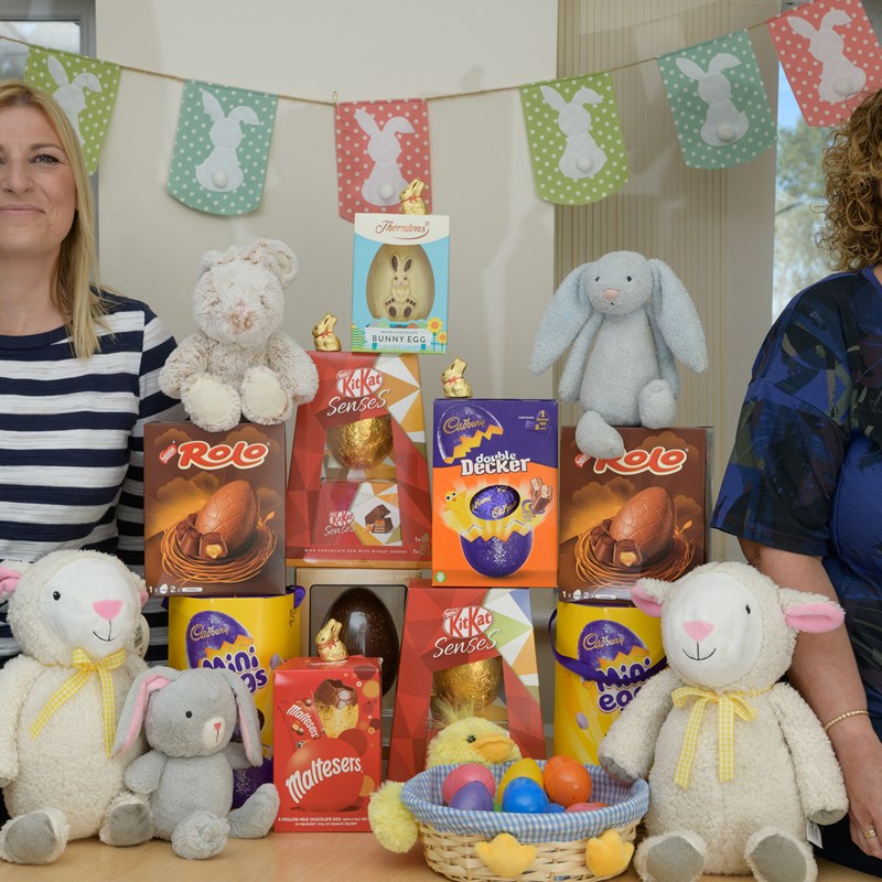 2 women sat with easter eggs and easter decorations