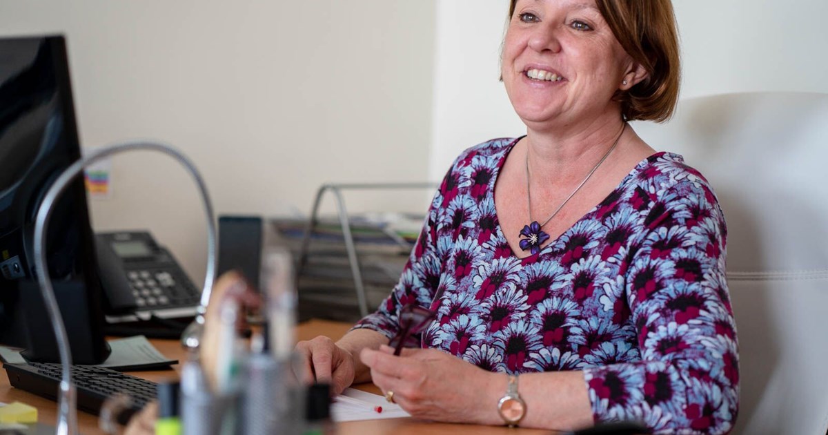 Lady (helen) at her desk