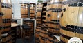 abywell finished whiskey barrels which have been turned into wine racks 