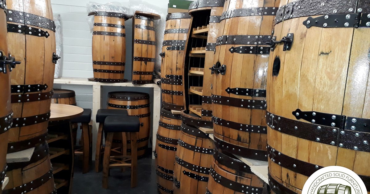 abywell finished whiskey barrels which have been turned into wine racks