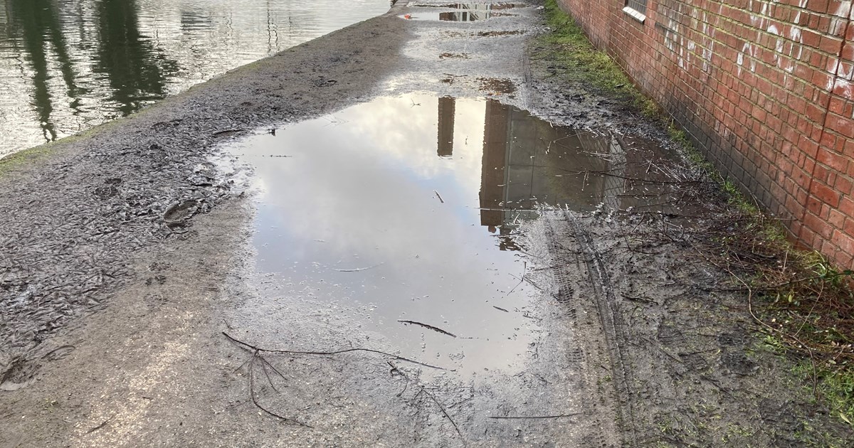 Image shows canal towpath in Kidderminster with flooded path